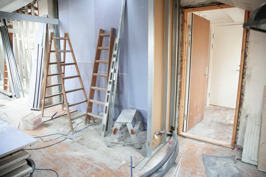 Drywall Demo A carefully removing old drywall, ensuring minimal damage to surrounding structures