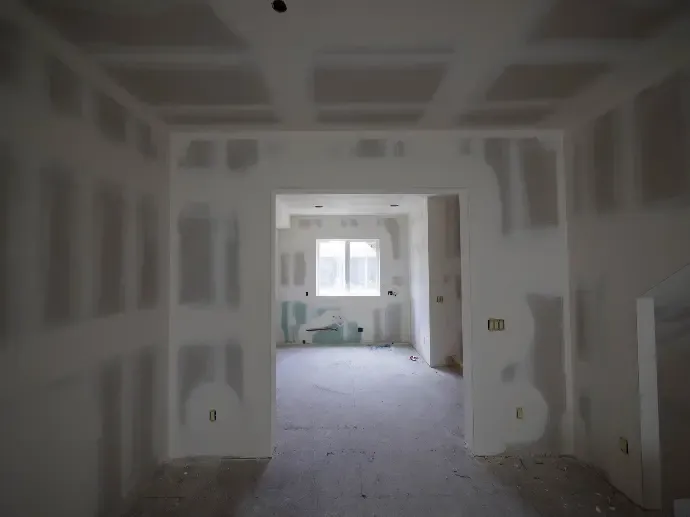 corridor with drywall work done