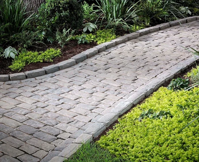 interlocking concrete brick pavers installed in a walkway