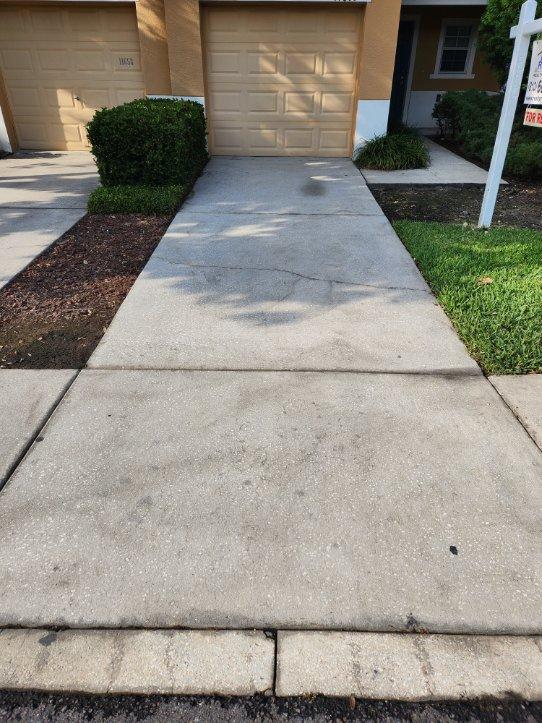 concrete driveway walkway infront of garage