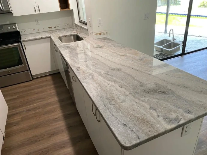 flowing white and brown patterns quartzite countertop